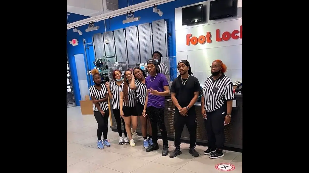 Lil Baby posing with Foot Locker employees after buying out the entire  store to give sneakers away. Lil Baby is planning on giving back to…